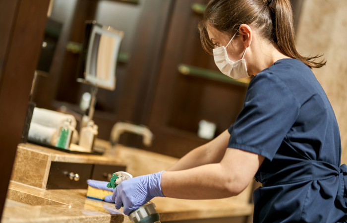 housemaid-in-uniform-and-protective-gloves-cleanin-2023-11-27-04-49-16-utc