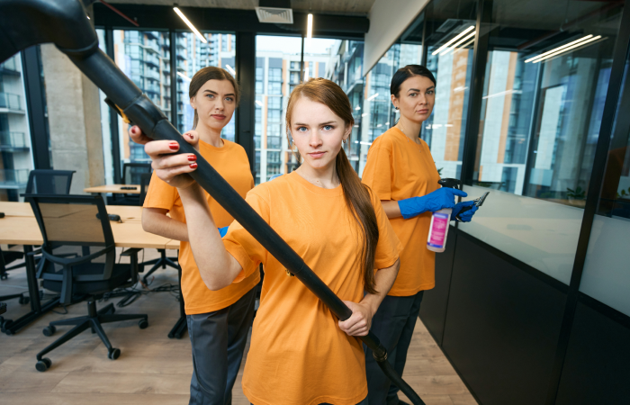 three-cleaning-company-workers-in-uniform-cleaning-2023-11-27-05-33-08-utc