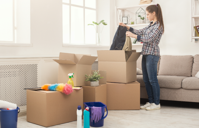 young-woman-unpacking-boxes-after-moving-2024-11-21-02-35-08-utc